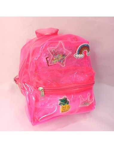 Mochila transparente rosa con parches